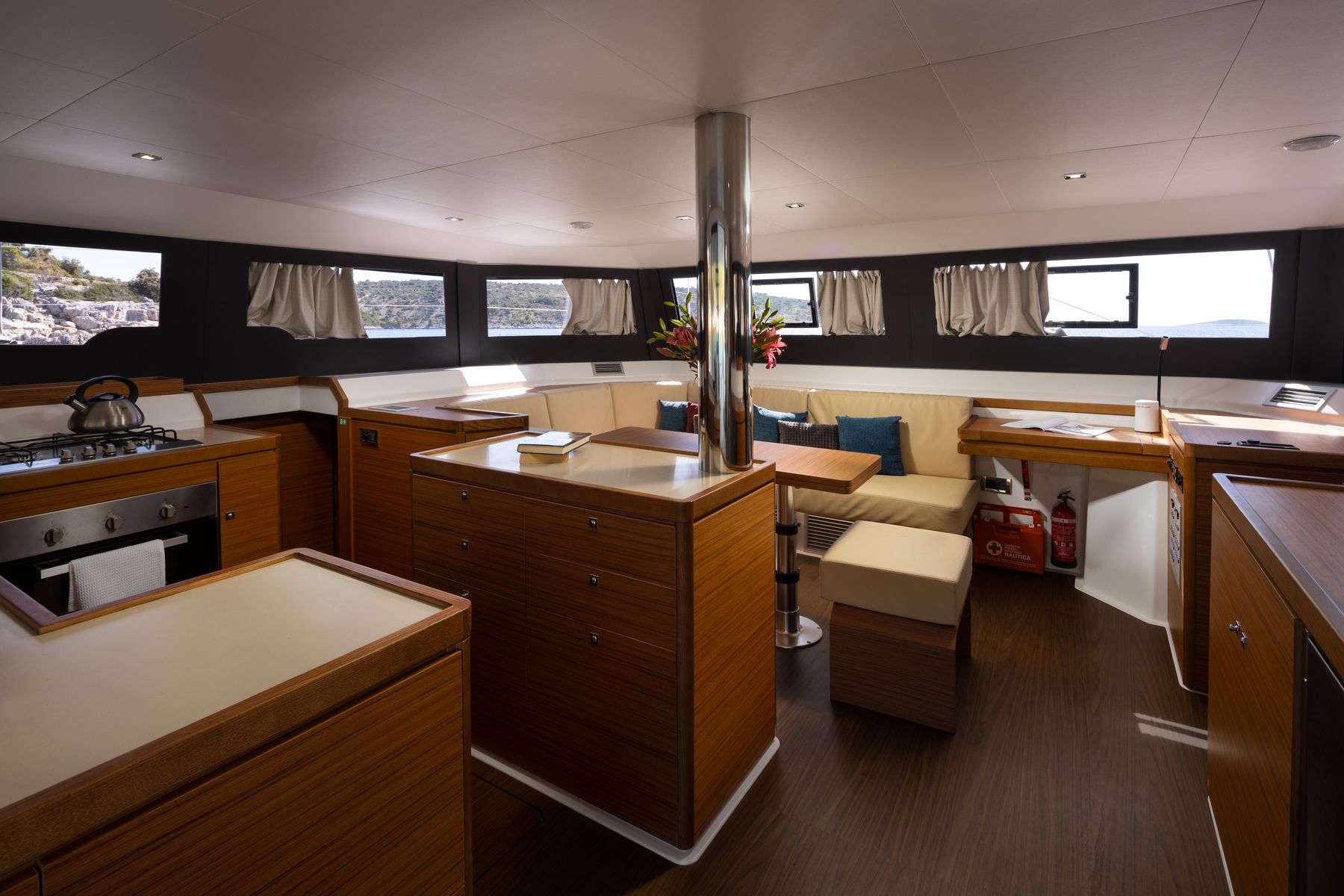 The saloon and galley, lit by panoramic windows
